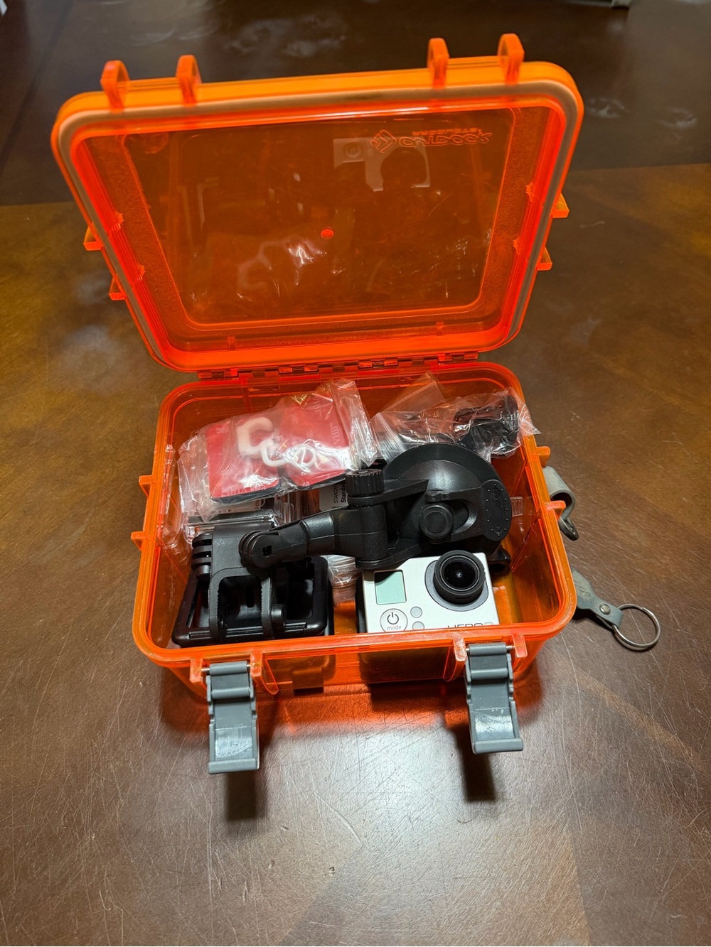 GoPro Action Camera with Orange Hard Case and Mounts